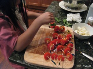 Good helper assembling appetizers