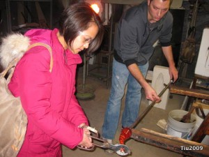 Julie's turn to work with hot glass